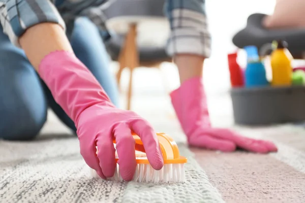 depositphotos_272174822-stock-photo-woman-cleaning-carpet-with-brush
