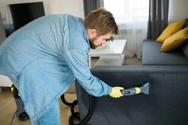 depositphotos_650902780-stock-photo-man-protective-rubber-glove-cleaning