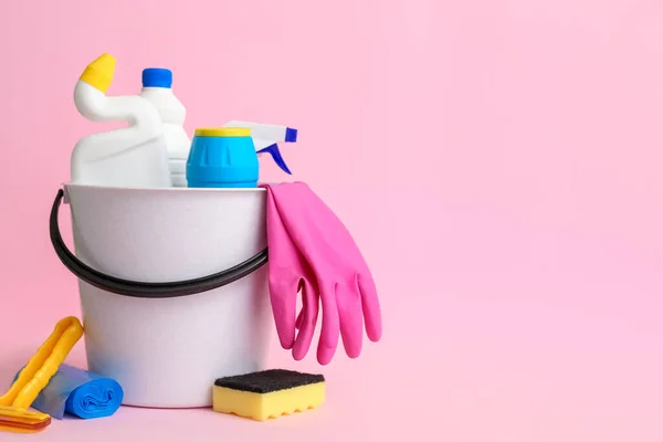 depositphotos_663736026-stock-photo-bucket-different-cleaning-supplies-pink